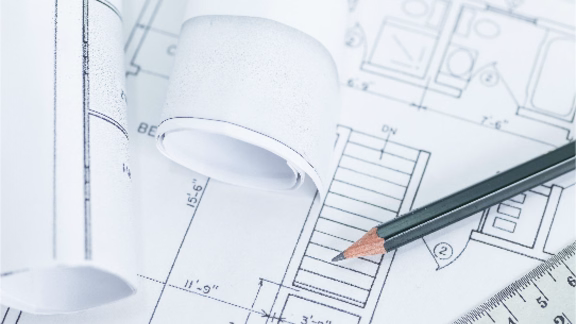 Blueprint for a house with a pen